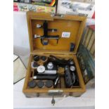 A cased Tiyoda microscope with lenses