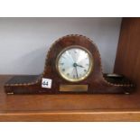 A walnut mantel clock