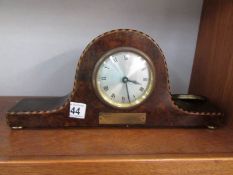 A walnut mantel clock