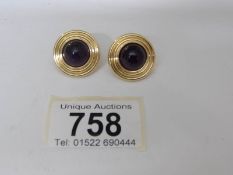 A pair of amethyst set post clip earrings in 18ct gold, 13.