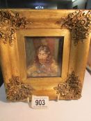 A gilt framed hand painted portrait on ivory
