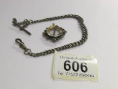 A silver watch chain (17g) and a silver compass