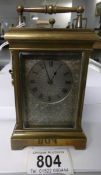 A brass repeater carriage clock with silver dial, marked E W Streeter, 18, New Bond Street, London,