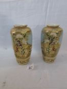 A pair of 19th century Satsuma vases with 9 symbal makers marks