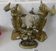 A 19th century gilt bronze figure of warrior dancers and a pair of early 20th century brass and