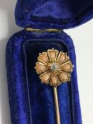 A superb gold stick pin set central diamonds and 'natural pearls?' in original case