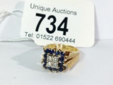 A diamond and sapphire 1970's ring in textured 18ct gold,