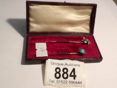 2 cased fine gold stick pins of insect form, one set turquoise and diamonds,