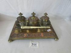 A superb 19th century inkstand with copper embossing and with Chinese dip pen