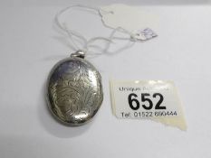 An engraved silver locket