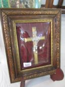 A framed and glazed good quality crucifix with domed glass