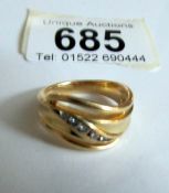 An 18ct gold and diamond ring size N