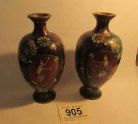 A pair of 19th century cloissonne vases with fluted sides,