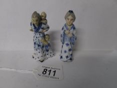 Two 19th century porcelain figures of asian ladies,
