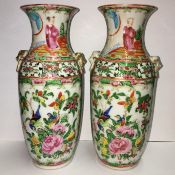 A pair of 19th century famille rose vases (approx 21cm high)
