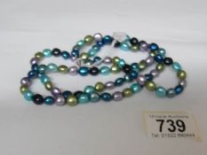 A double necklace of multi coloured cultured pearls