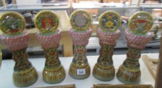 5 19th century or earlier ethnic pottery columns each with a different symbol on top