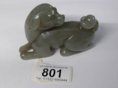 A 19th/20th century jade figure of a dog