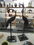 A pair of oriental bronze cranes