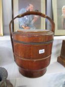 A 19th century Chinese wooden lidded rice pail in 3 layers