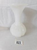 A white milk glass carved vase,