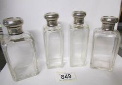 4 silver topped Mappin and Webb toilet bottles