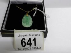 A jade pendant set in gold with 18ct gold chain, total weight 5.