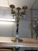 A brass and bakelite church candelabra