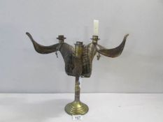 A rams horn candleholder