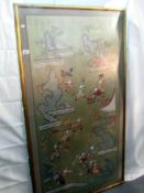 A large framed and glazed embroidered oriental panel of children at play