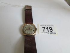 a 1940/50's 9ct gold cased wrist watch on leather strap,