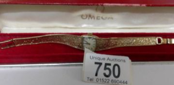 A ladies 9ct gold Omega watch in Omega case, in working order, 19.