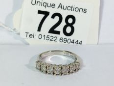 A diamond 7 stone band ring in 18ct white gold,