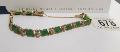 A Grade A, emerald green jadeite jade bracelet with 13 gemstones and 26 old cut diamonds, 15.
