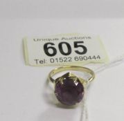 A 9ct gold ring set large amethyst coloured stone,