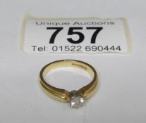 A single stone diamond ring in 18ct gold, 20pt,