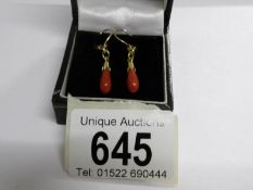 A pair of vintage coral ear pendants in 9ct gold