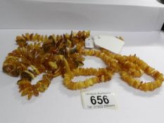 2 long necklaces of yellow amber