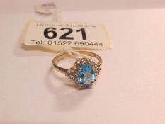 A blue topaz cluster ring in 9ct gold,