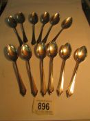 12 silver (800) spoons,
