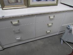 A white 6 drawer dressing table