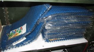 A large quantity of plastic floor mats