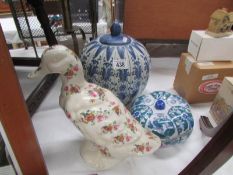 2 blue and white ginger jars and a duck
