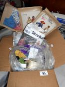 A box of dress patterns and other sewing items