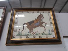 A framed and glazed picture of a horse
