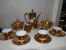 A gilded coffee set