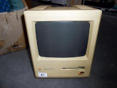 A vintage Macintosh plus computer