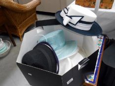 A hat box and hats