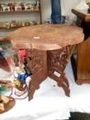 A carved side table