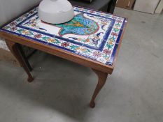 A tiled top coffee table